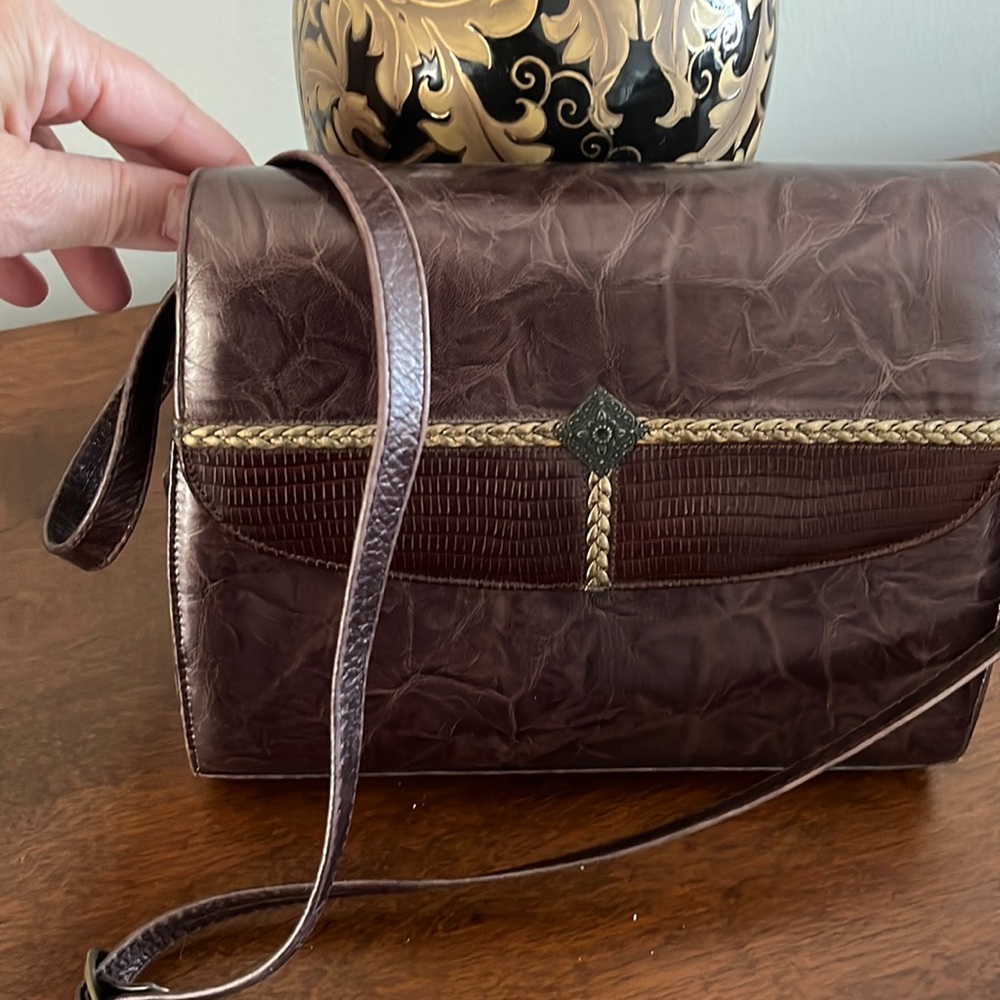 Like new brown purse. Leather upper. Manmade inner.  Made in Spain. Margaret J.